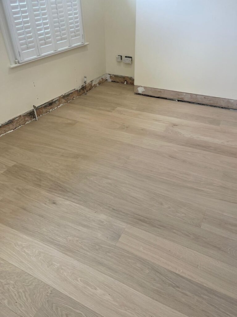 Wide-board engineered wood floor during fitting by R3 Carpentry floor fitters