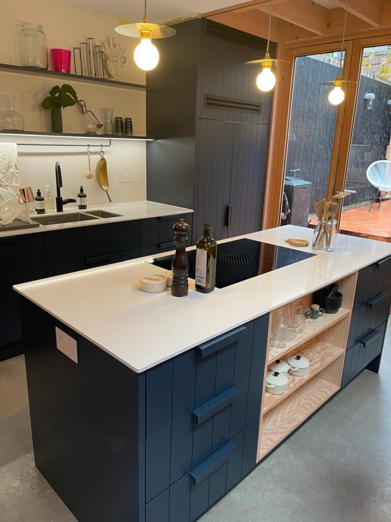 Fitted kitchen with central island and marble-effect worktop by R3 Carpentry, West London