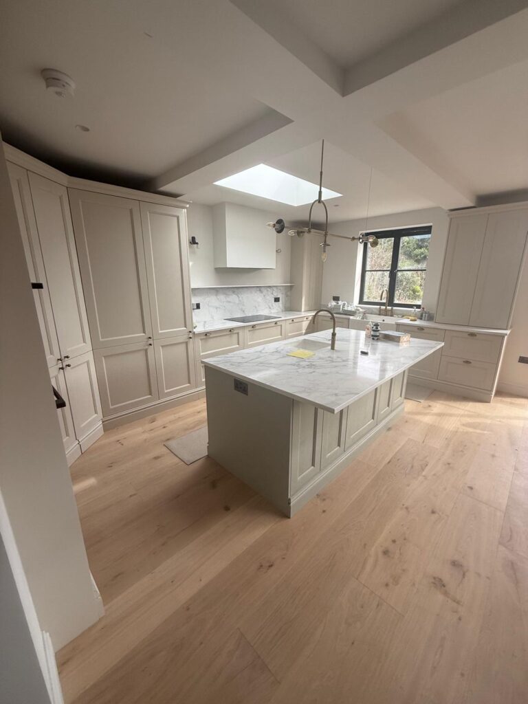 Kitchen island and wood flooring installed by kitchen fitters in Hammersmith W6